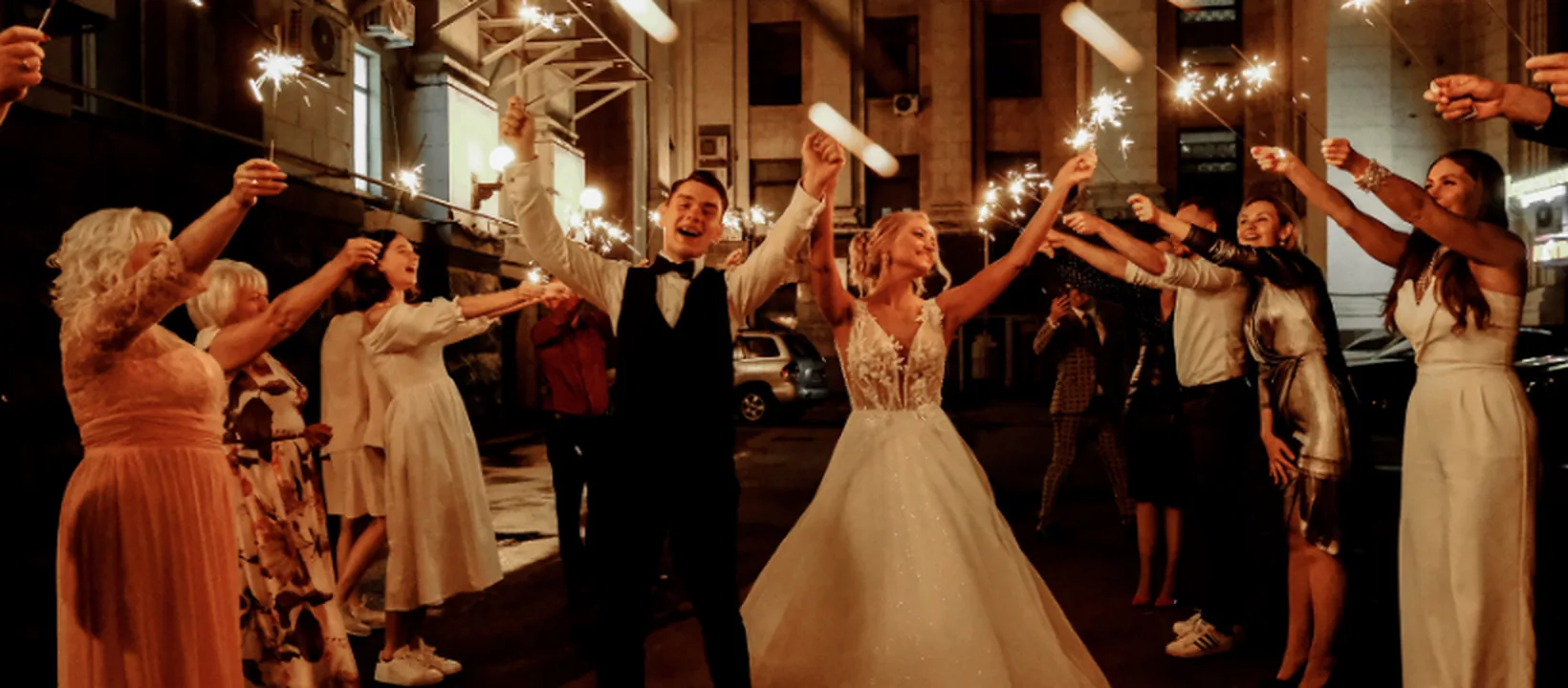 Wedding guests celebrating together during an evening reception