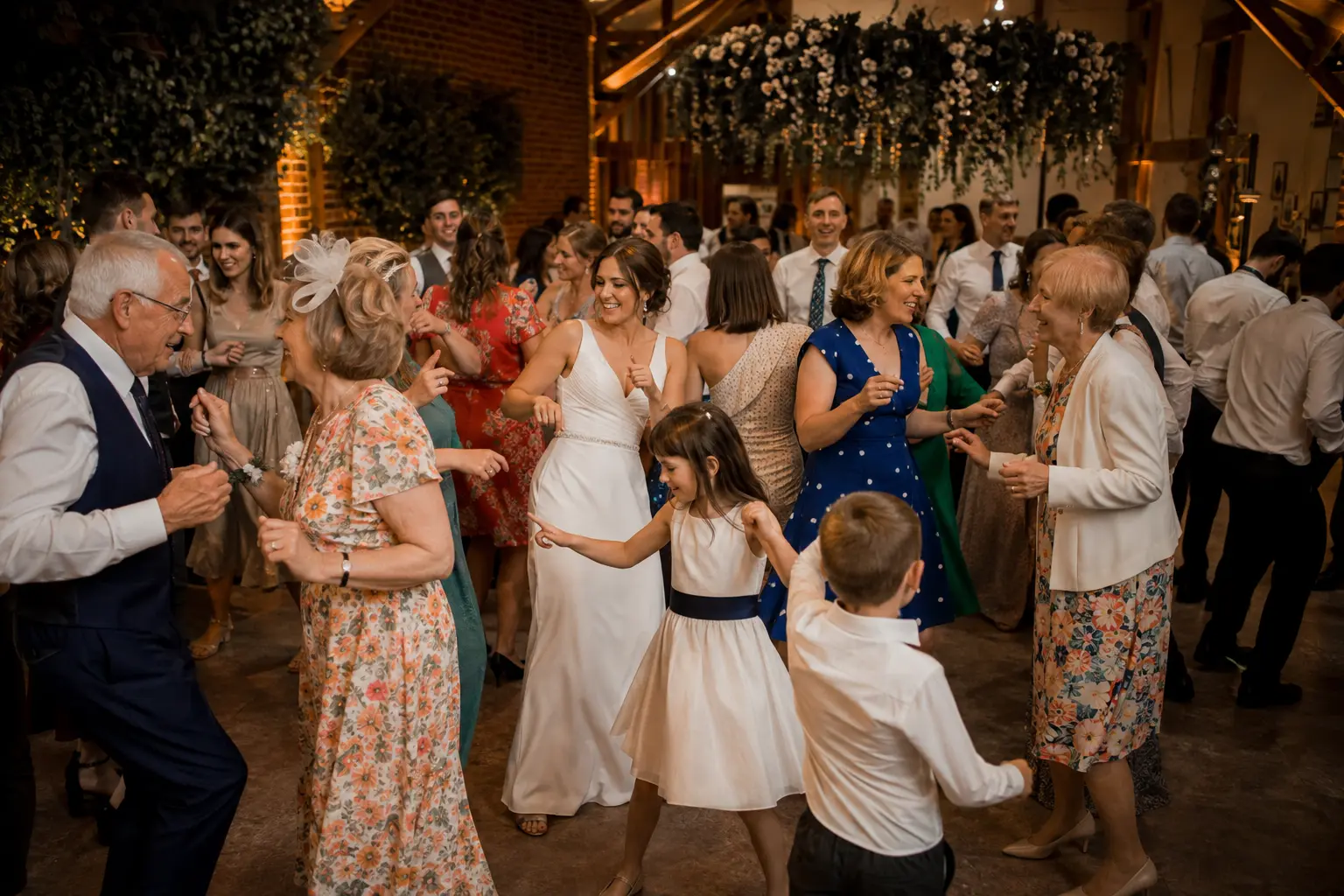Guests of different generations enjoying a lively wedding dancefloor together